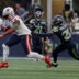 Sep 9, 2026; Seattle, Washington, USA; New England Patriots wide receiver A.J. Brown (1) runs against Seattle Seahawks cornerback Nehemiah Pritchett (28) during the second quarter at Lumen Field.
