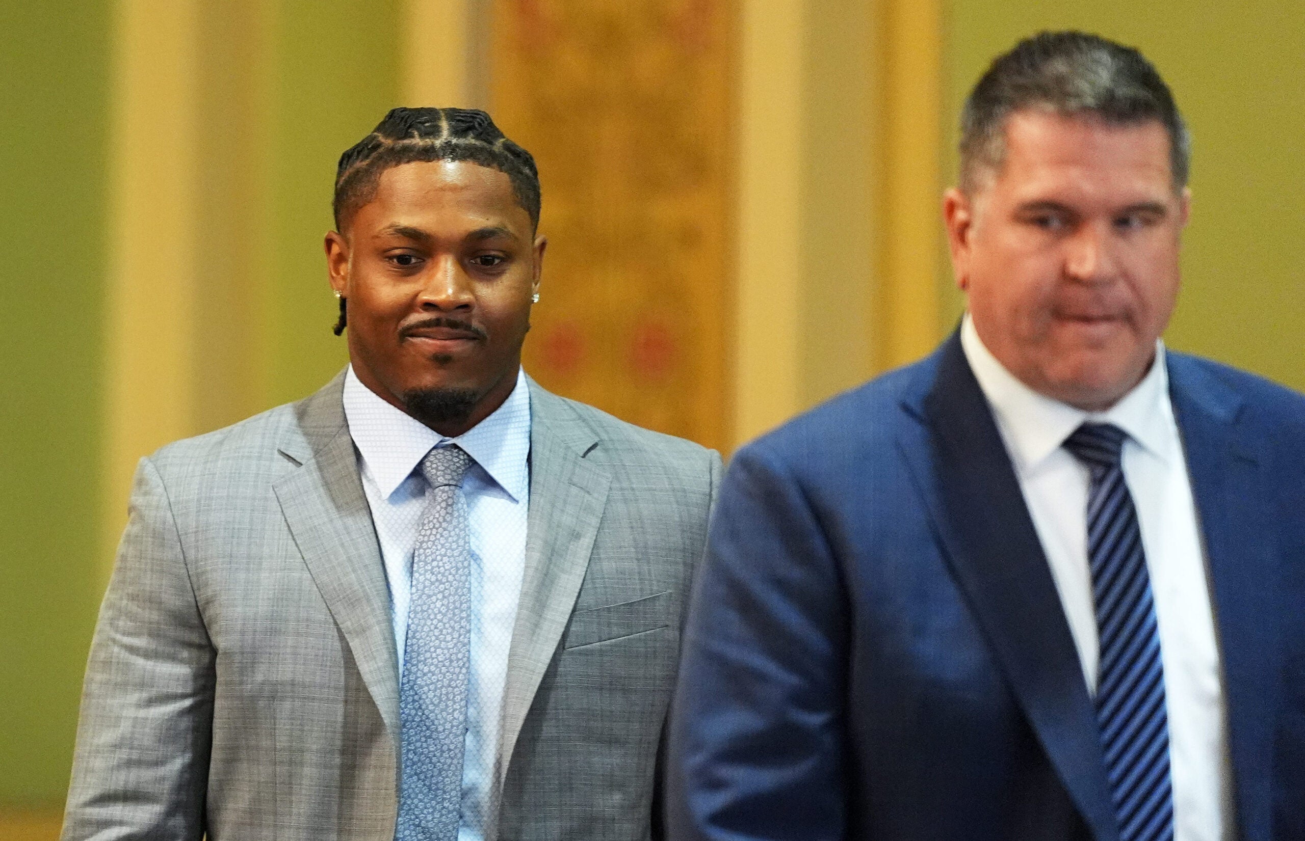 Green Bay Packers running back Josh Jacobs, right, appears in a Brown County courtroom on Sept. 10, 2026 in Green Bay, Wis., with his attorney Clarence Duchac III. He pleaded no contest to misdemeanor battery and criminal damage to property charges after a May incident.