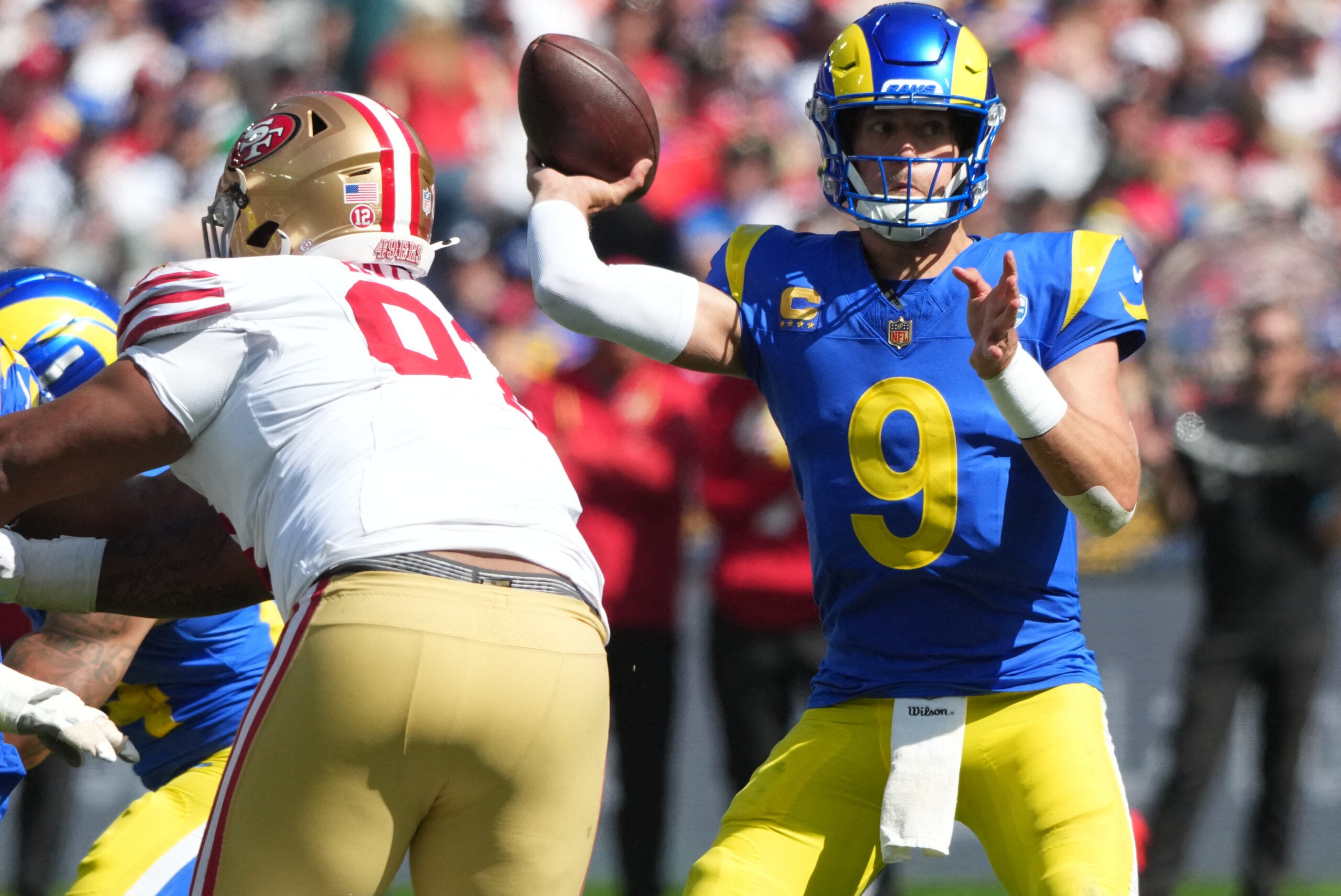 Sep 11, 2026; Melbourne, AUS; Los Angeles Rams quarterback Matthew Stafford (9) drops back to pass against the San Francisco 49ers in the second half at Melbourne Cricket Ground.