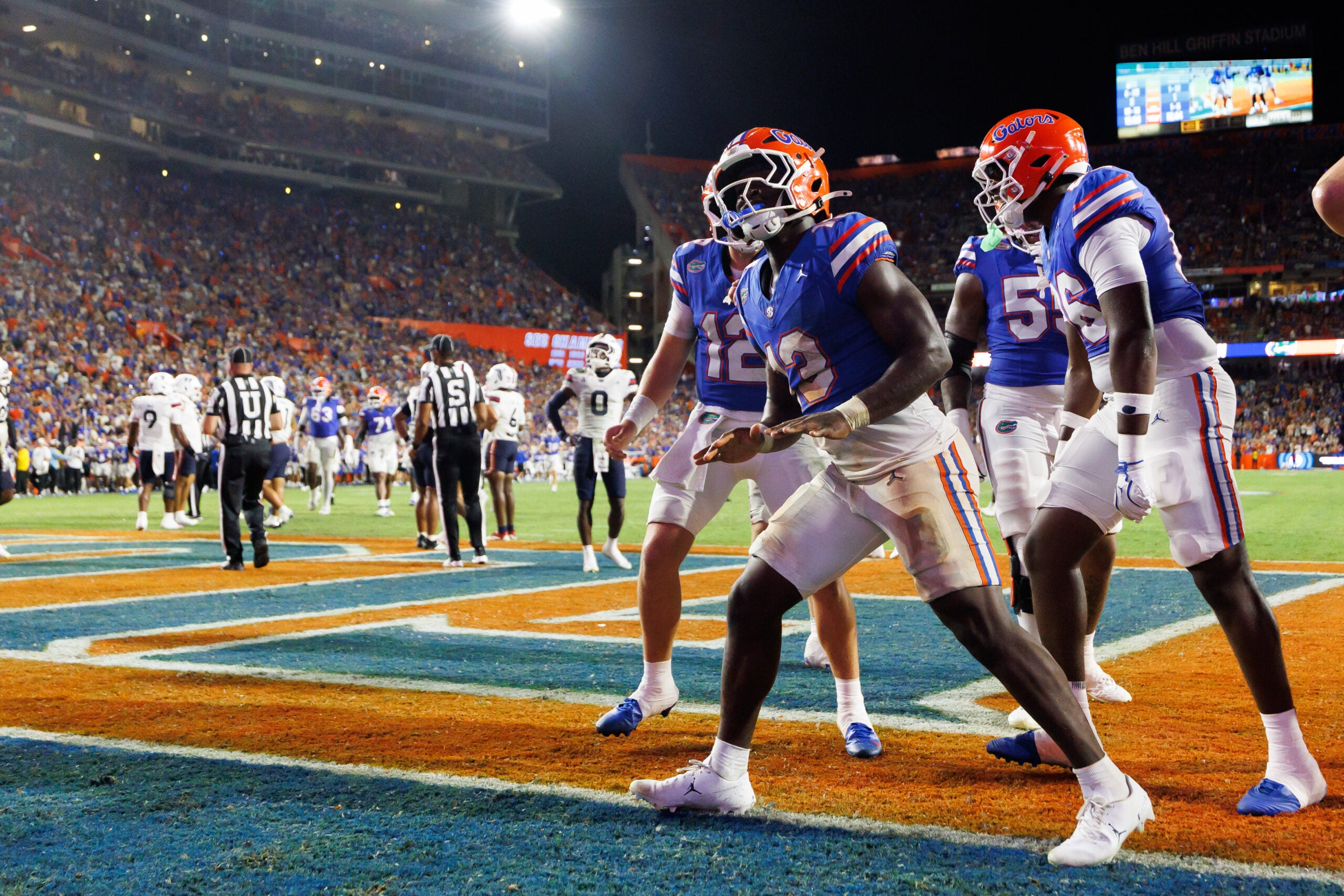 Sep 5, 2026; Gainesville, Florida, USA; Florida Gators running back Jadan Baugh (13) gestures with teammates against the Florida Atlantic Owls during the second half at Ben Hill Griffin Stadium.