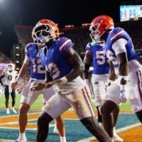 Sep 5, 2026; Gainesville, Florida, USA; Florida Gators running back Jadan Baugh (13) gestures with teammates against the Florida Atlantic Owls during the second half at Ben Hill Griffin Stadium.