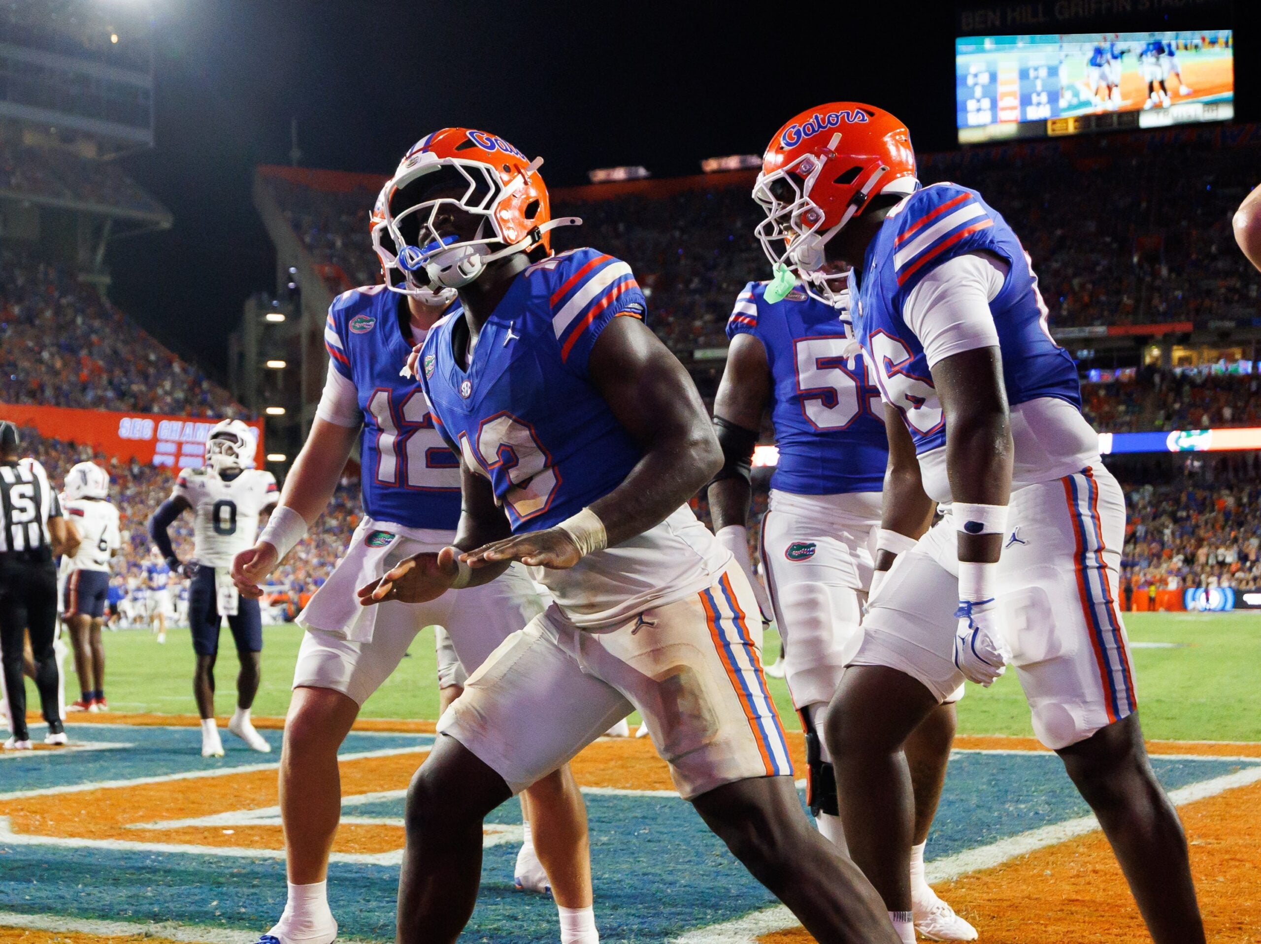 Sep 5, 2026; Gainesville, Florida, USA; Florida Gators running back Jadan Baugh (13) gestures with teammates against the Florida Atlantic Owls during the second half at Ben Hill Griffin Stadium.