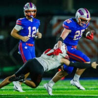 Bishop Kenny Crusaders Ashton Green (17) tries to tackle Bolles Bulldogs running back Xander Edwards (25) in the second quarter. The Bolles Bulldogs hosted the Bishop Kenny Crusaders Friday September 11, 2026 at Bolles School in Jacksonville, Fla. Bolles lead 21-6 at the half.