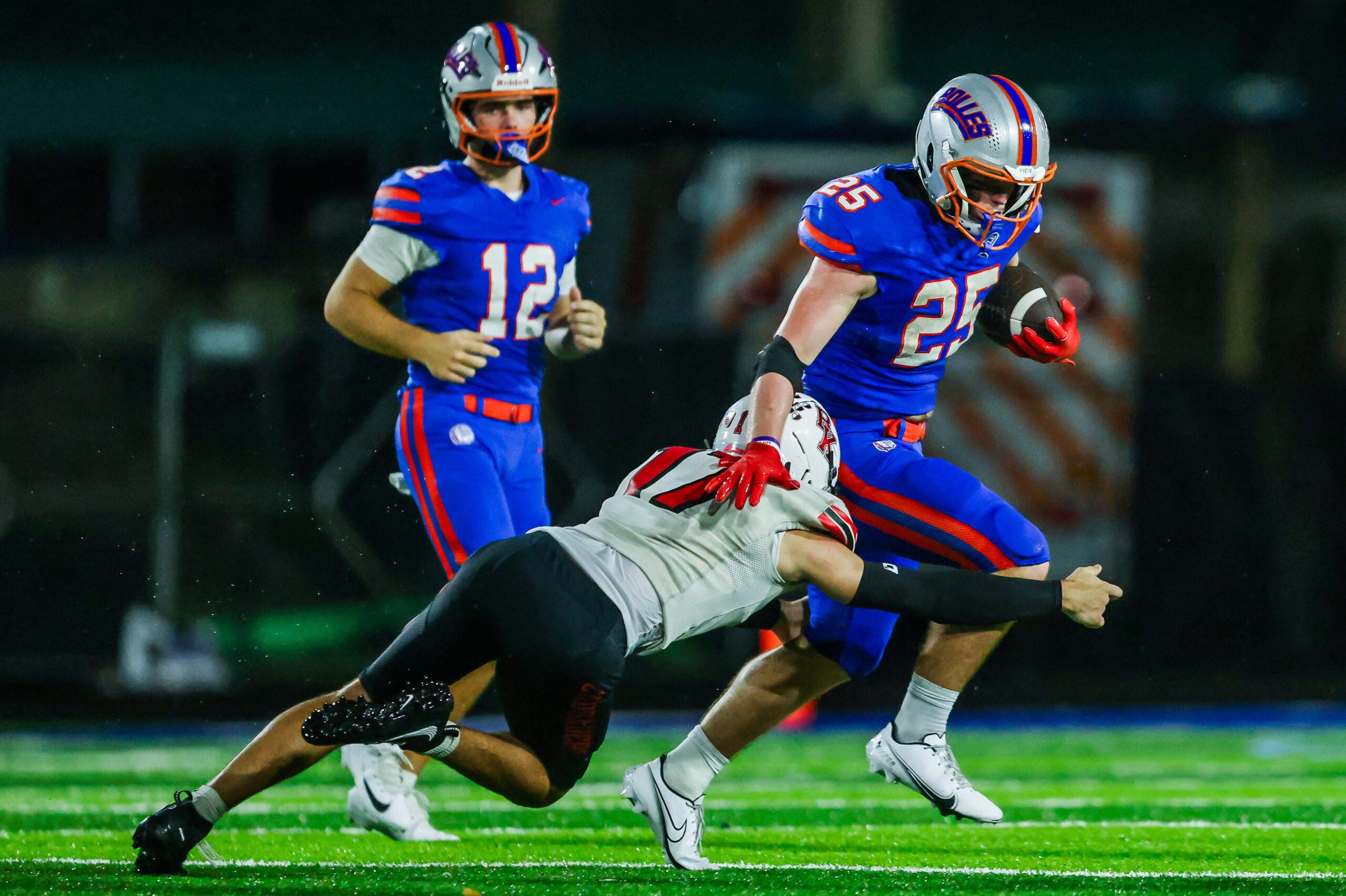 Bishop Kenny Crusaders Ashton Green (17) tries to tackle Bolles Bulldogs running back Xander Edwards (25) in the second quarter. The Bolles Bulldogs hosted the Bishop Kenny Crusaders Friday September 11, 2026 at Bolles School in Jacksonville, Fla. Bolles lead 21-6 at the half.