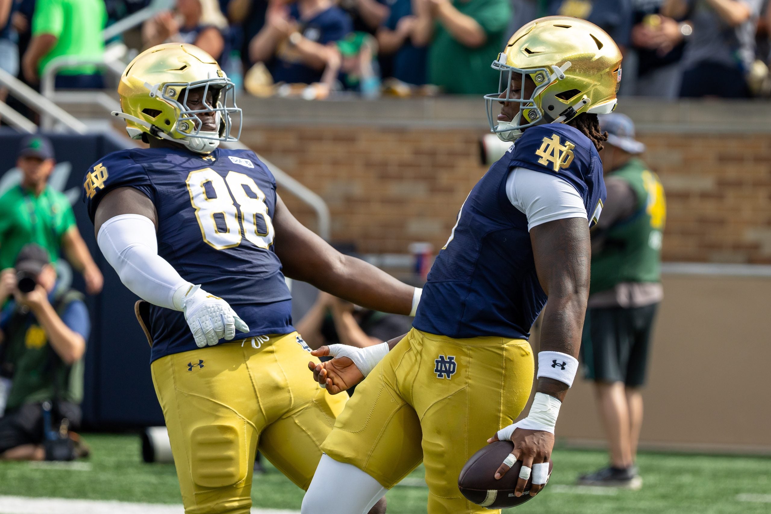 Sep 12, 2026; South Bend, Indiana, USA; Notre Dame Fighting Irish defensive lineman Boubacar Traore (5) celebrates scoring with defensive lineman Armel Mukam (88) against the Rice Owls during the first half at Notre Dame Stadium.