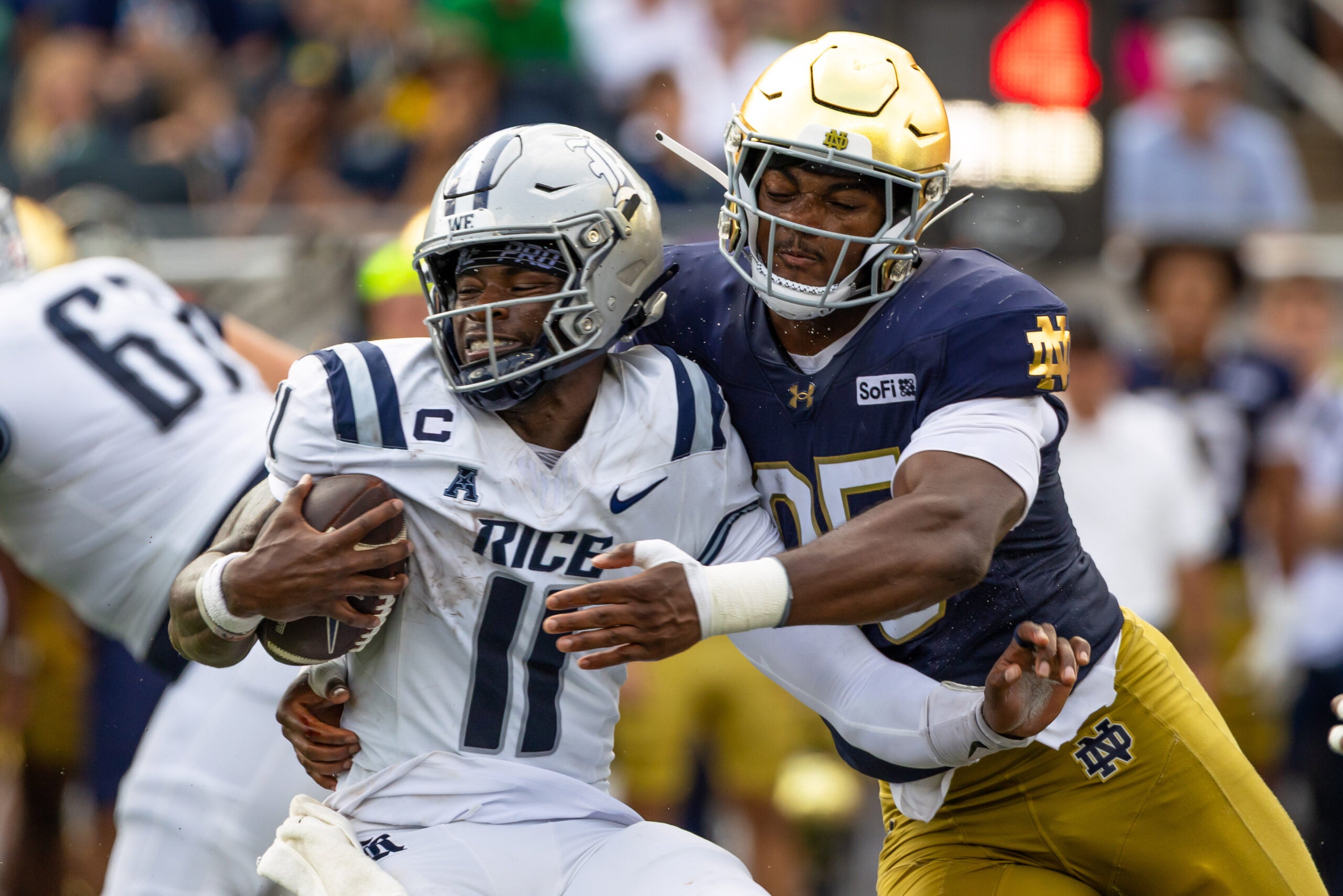 Sep 12, 2026; South Bend, Indiana, USA; Notre Dame Fighting Irish defensive lineman Bryce Young (95) attempts to tackle Rice Owls quarterback Jacurri Brown (11) during the first half at Notre Dame Stadium.