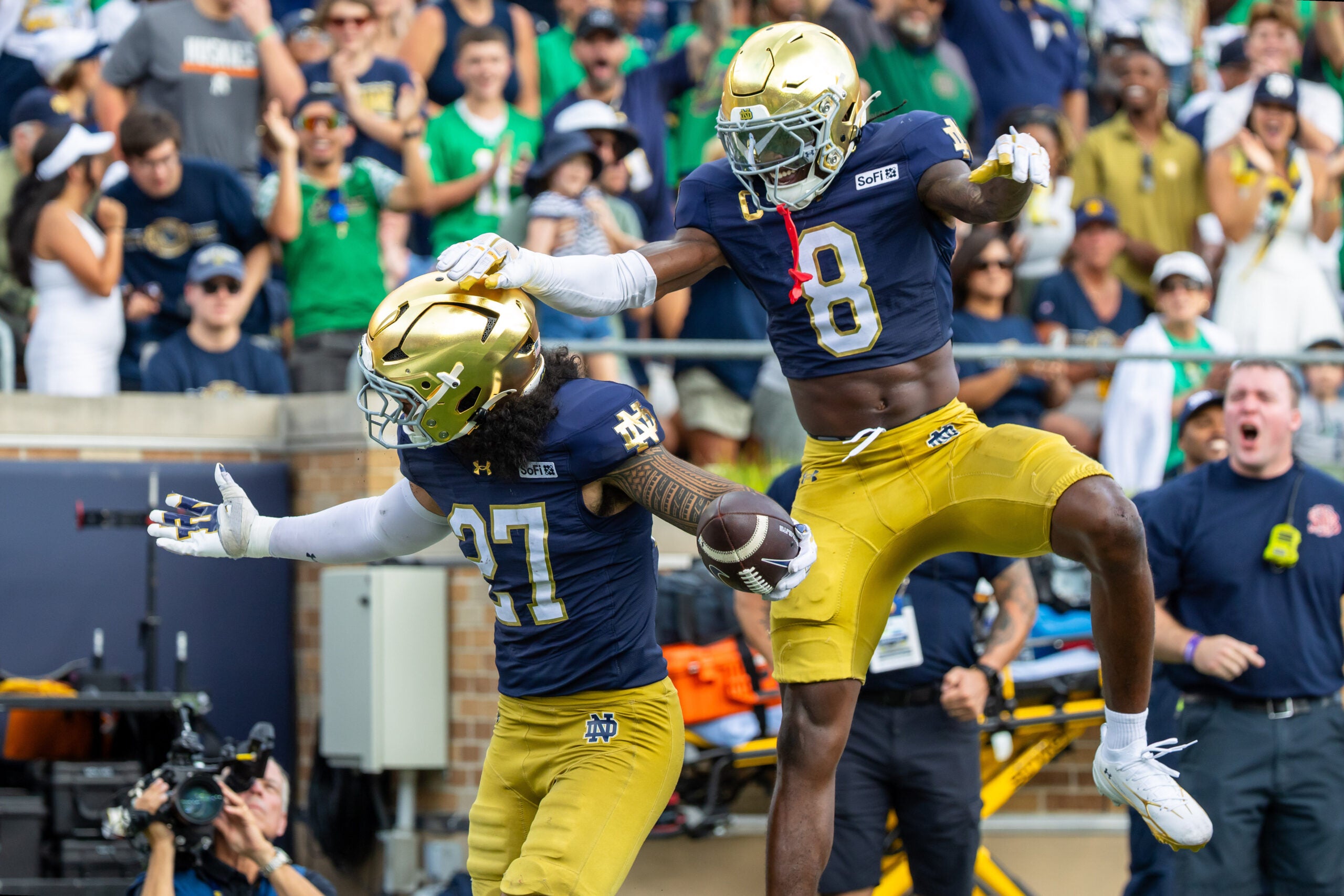Sep 12, 2026; South Bend, Indiana, USA; Notre Dame Fighting Irish safety Adon Shuler (8) celebrates with linebacker Kyngstonn Viliamu-Asa (27) after a turnover during the first half at Notre Dame Stadium.