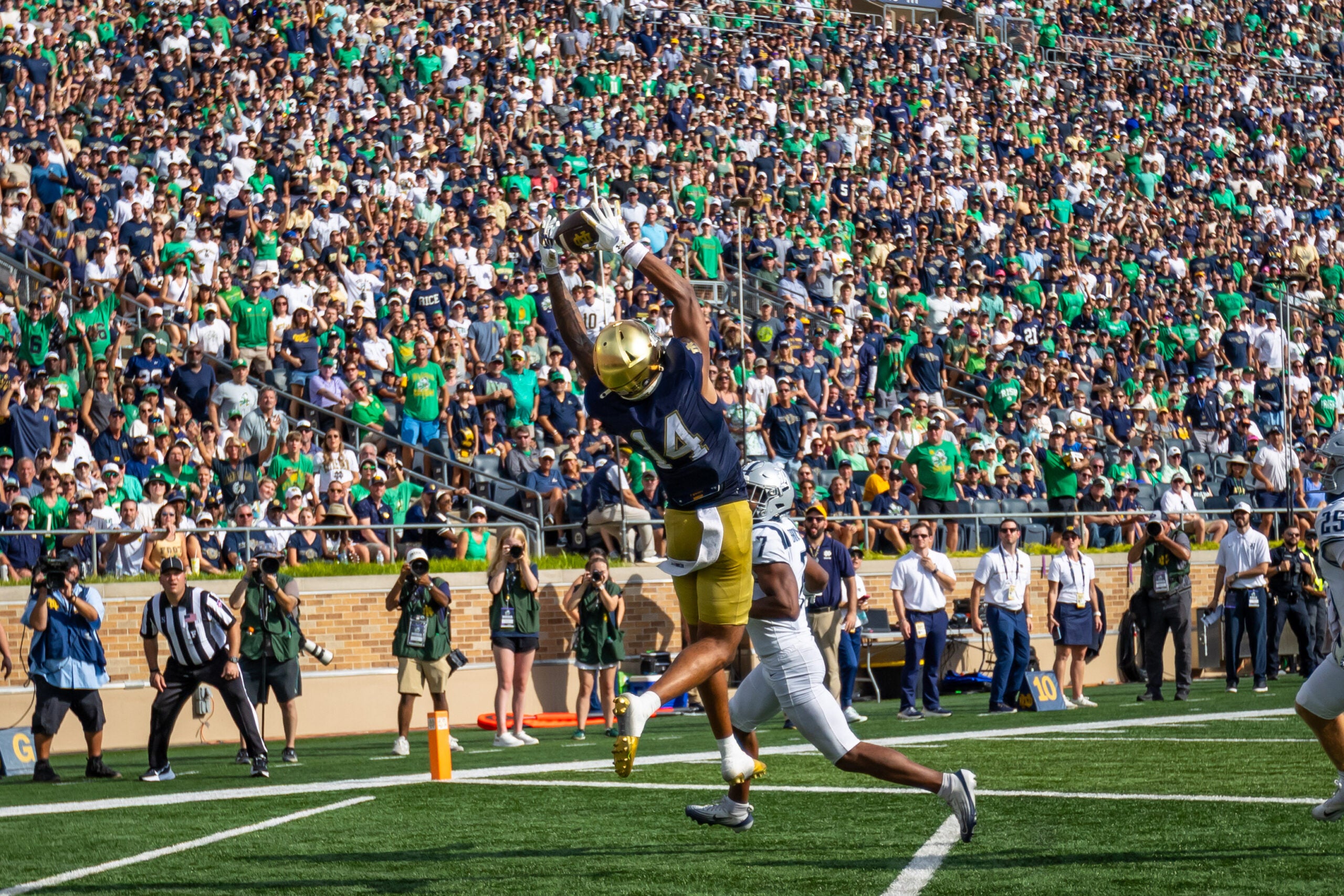 Sep 12, 2026; South Bend, Indiana, USA; Notre Dame Fighting Irish wide receiver Micah Gilbert (14) makes a catch for a touchdown against the Rice Owls during the first half at Notre Dame Stadium.