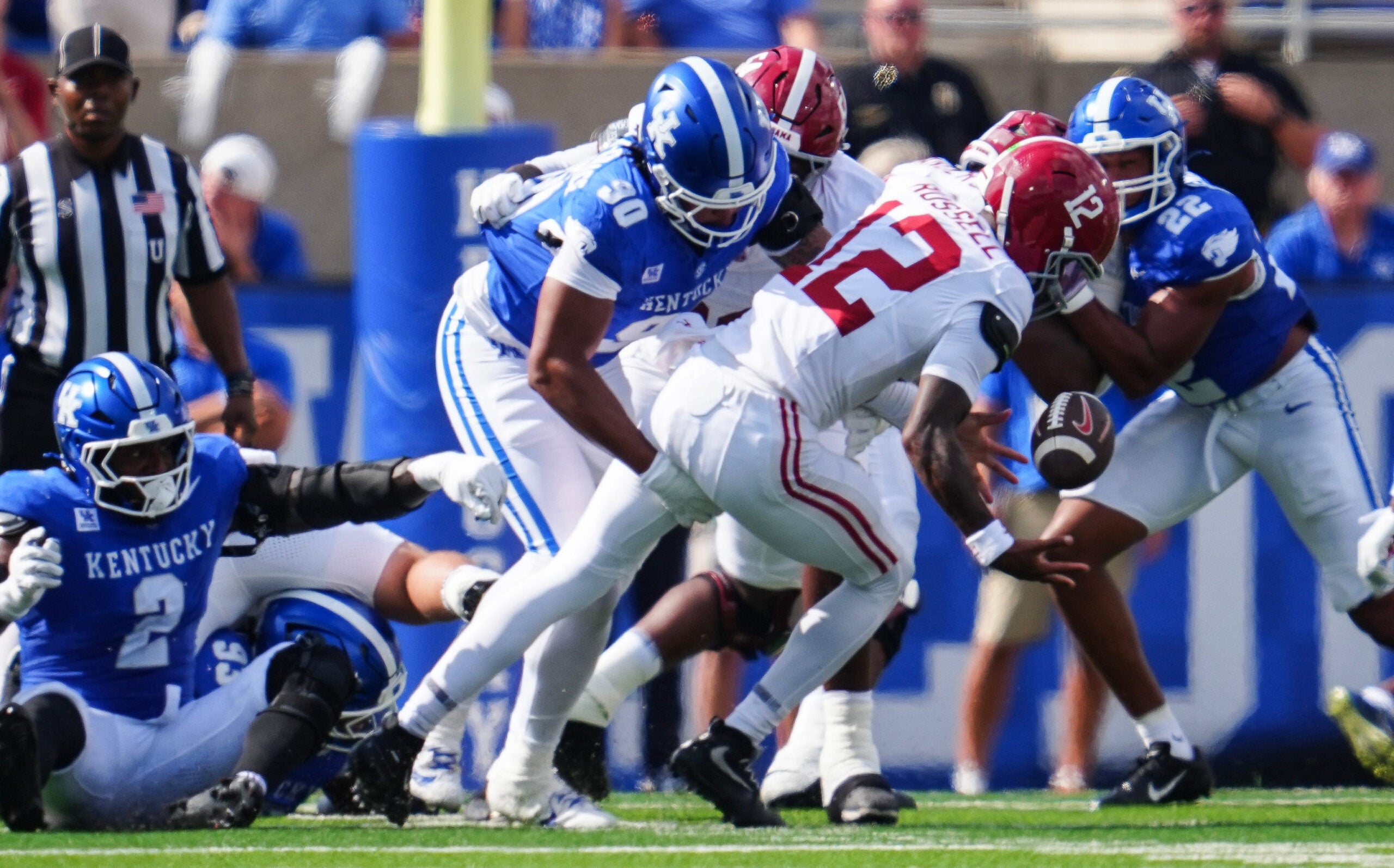 Kentucky Wildcats defensive lineman Mi'quise Humphrey-Grace (90) hits Alabama Crimson Tide quarterback Keelon Russell (12) to cause a Tide fumble and Cat recover in the first half Saturday, Sept. 12, 2026 in Lexington, Kentucky.