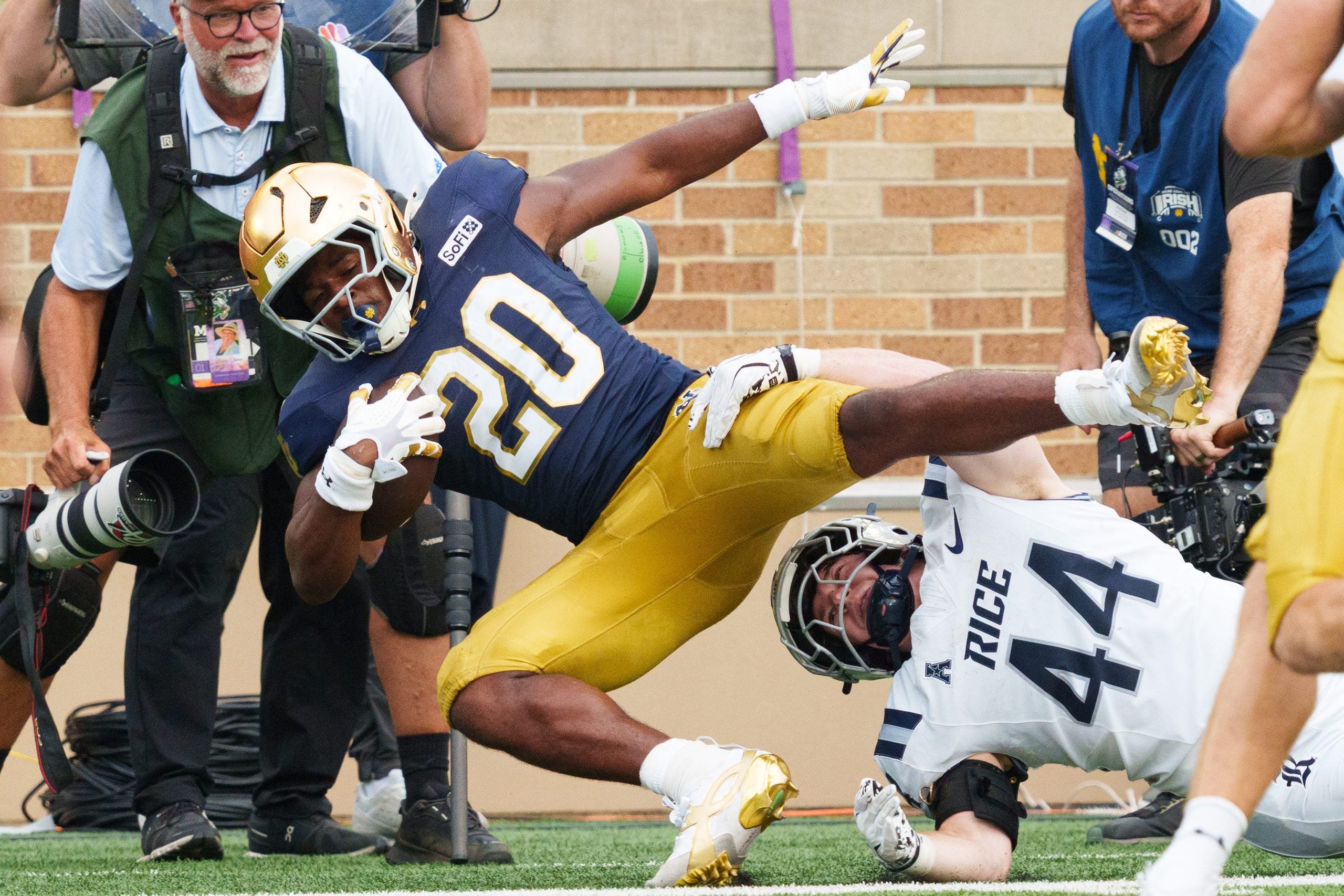 Rice linebacker Cooper King (44) tackles Notre Dame running back Jonaz Walton (20) during a NCAA football game at Notre Dame Stadium on Saturday, Sept. 12, 2026, in South Bend.