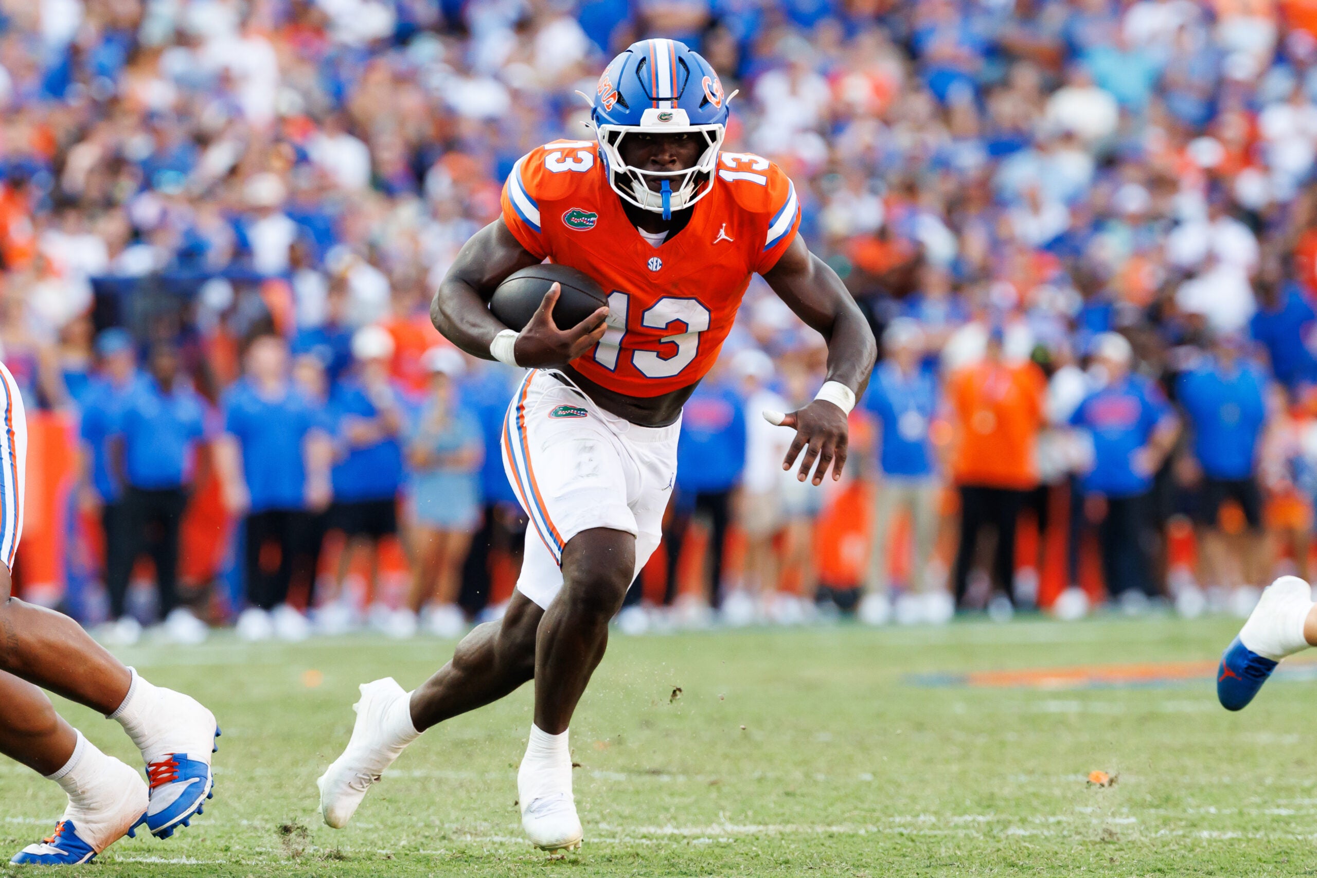 Sep 12, 2026; Gainesville, Florida, USA; Florida Gators running back Jadan Baugh (13) rushes with the ball against the Campbell Fighting Camels during the first half at Ben Hill Griffin Stadium.