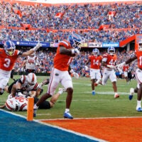 Sep 12, 2026; Gainesville, Florida, USA; Florida Gators wide receiver Vernell Brown III (1) scores a touchdown while wide receivers Bailey Stockton (3) and Davian Groce (18) celebrate against the Campbell Fighting Camels during the first half at Ben Hill Griffin Stadium.