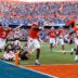 Sep 12, 2026; Gainesville, Florida, USA; Florida Gators wide receiver Vernell Brown III (1) scores a touchdown while wide receivers Bailey Stockton (3) and Davian Groce (18) celebrate against the Campbell Fighting Camels during the first half at Ben Hill Griffin Stadium.