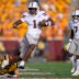 Sep 12, 2026; Minneapolis, Minnesota, USA; Mississippi State Bulldogs quarterback Kamario Taylor (1) breaks the tackle attempt of Minnesota Golden Gophers defensive back John Nestor (17) during the fourth quarter at Huntington Bank Stadium.