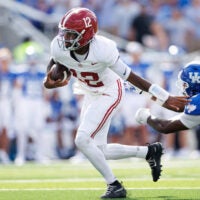 Sep 12, 2026; Lexington, Kentucky, USA; Alabama Crimson Tide quarterback Keelon Russell (12) runs the ball during the second quarter against the Kentucky Wildcats at Kroger Field.