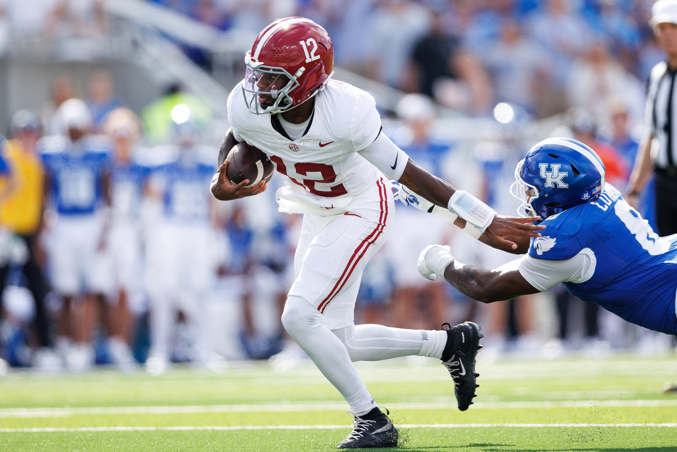 Sep 12, 2026; Lexington, Kentucky, USA; Alabama Crimson Tide quarterback Keelon Russell (12) runs the ball during the second quarter against the Kentucky Wildcats at Kroger Field.