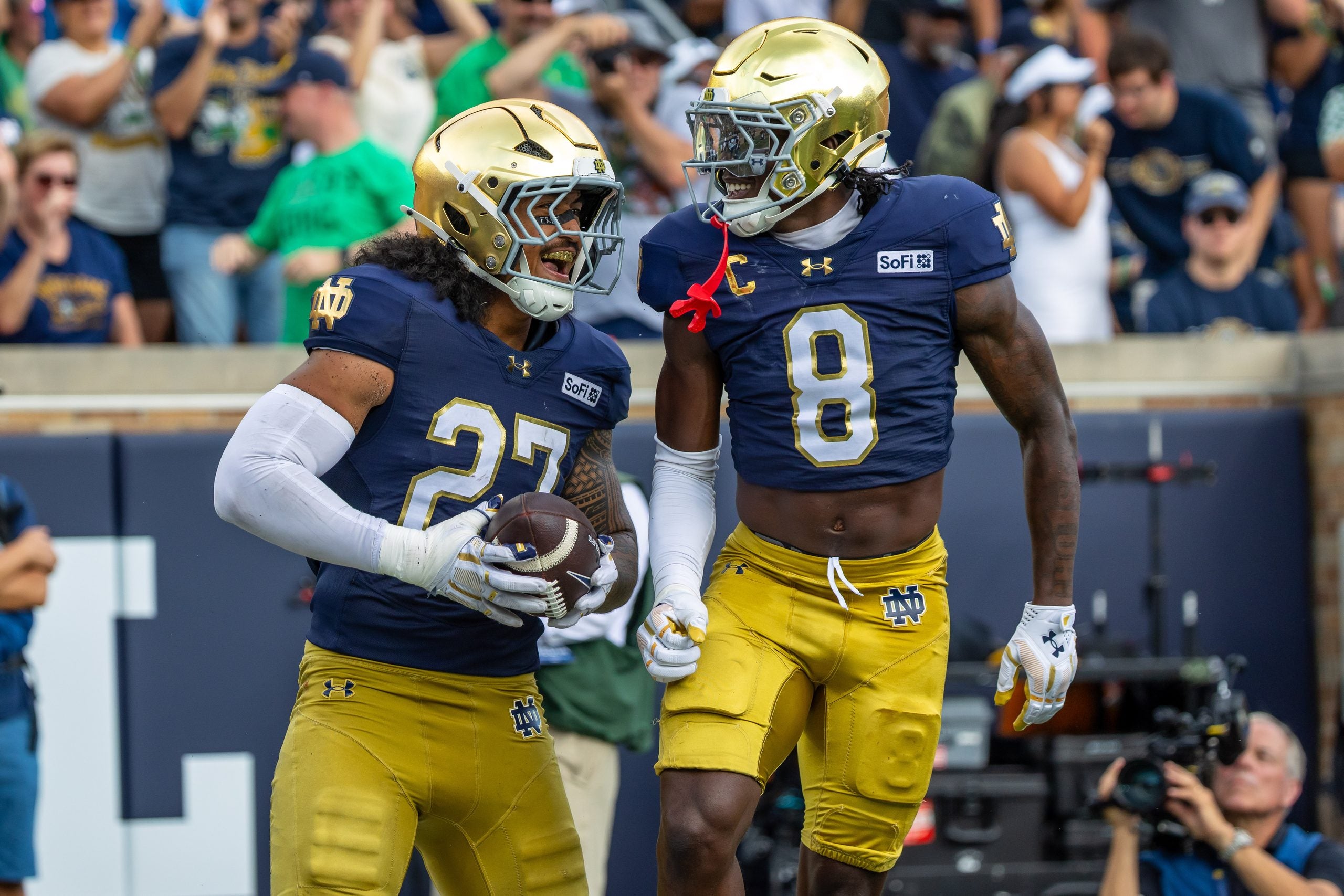 Sep 12, 2026; South Bend, Indiana, USA; Notre Dame Fighting Irish safety Adon Shuler (8) celebrates with linebacker Kyngstonn Viliamu-Asa (27) after a turnover during the first half at Notre Dame Stadium.