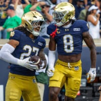 Sep 12, 2026; South Bend, Indiana, USA; Notre Dame Fighting Irish safety Adon Shuler (8) celebrates with linebacker Kyngstonn Viliamu-Asa (27) after a turnover during the first half at Notre Dame Stadium.