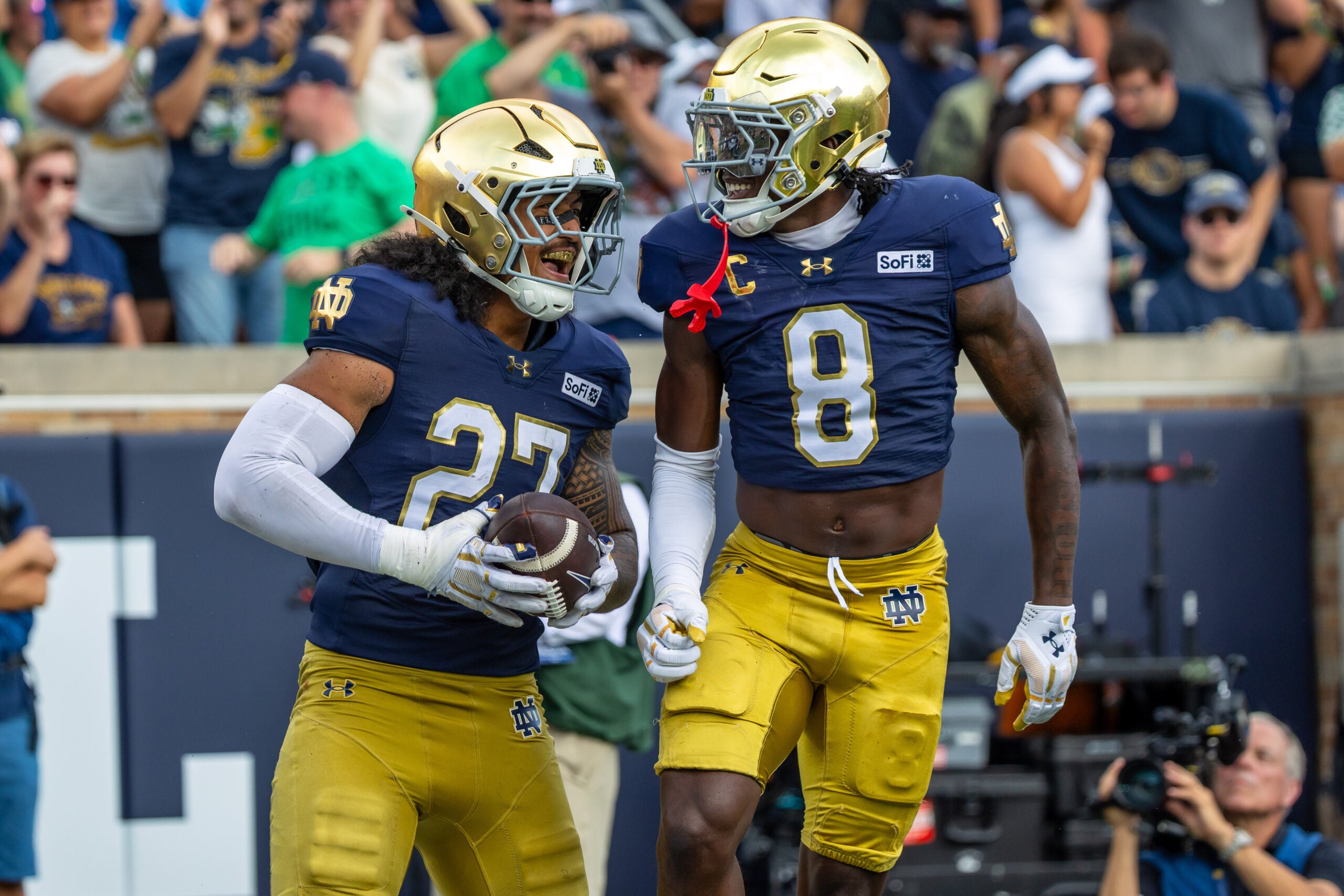 Sep 12, 2026; South Bend, Indiana, USA; Notre Dame Fighting Irish safety Adon Shuler (8) celebrates with linebacker Kyngstonn Viliamu-Asa (27) after a turnover during the first half at Notre Dame Stadium.