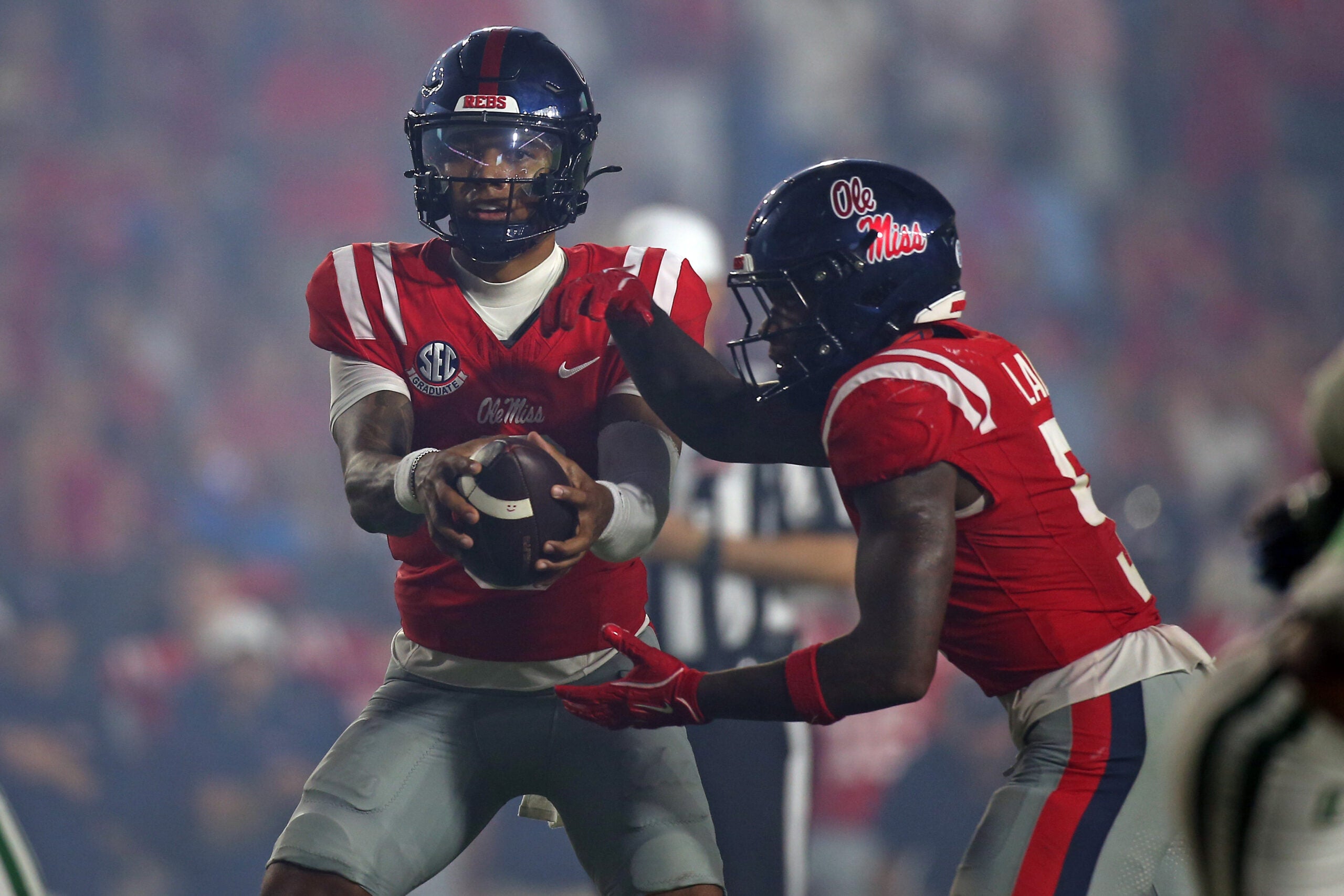 Sep 12, 2026; Oxford, Mississippi, USA; Mississippi Rebels quarterback Trinidad Chambliss (6) fakes the handoff to running back Kewan Lacy (5) during the fourth quarter against the Charlotte 49ers at Vaught-Hemingway Stadium.
