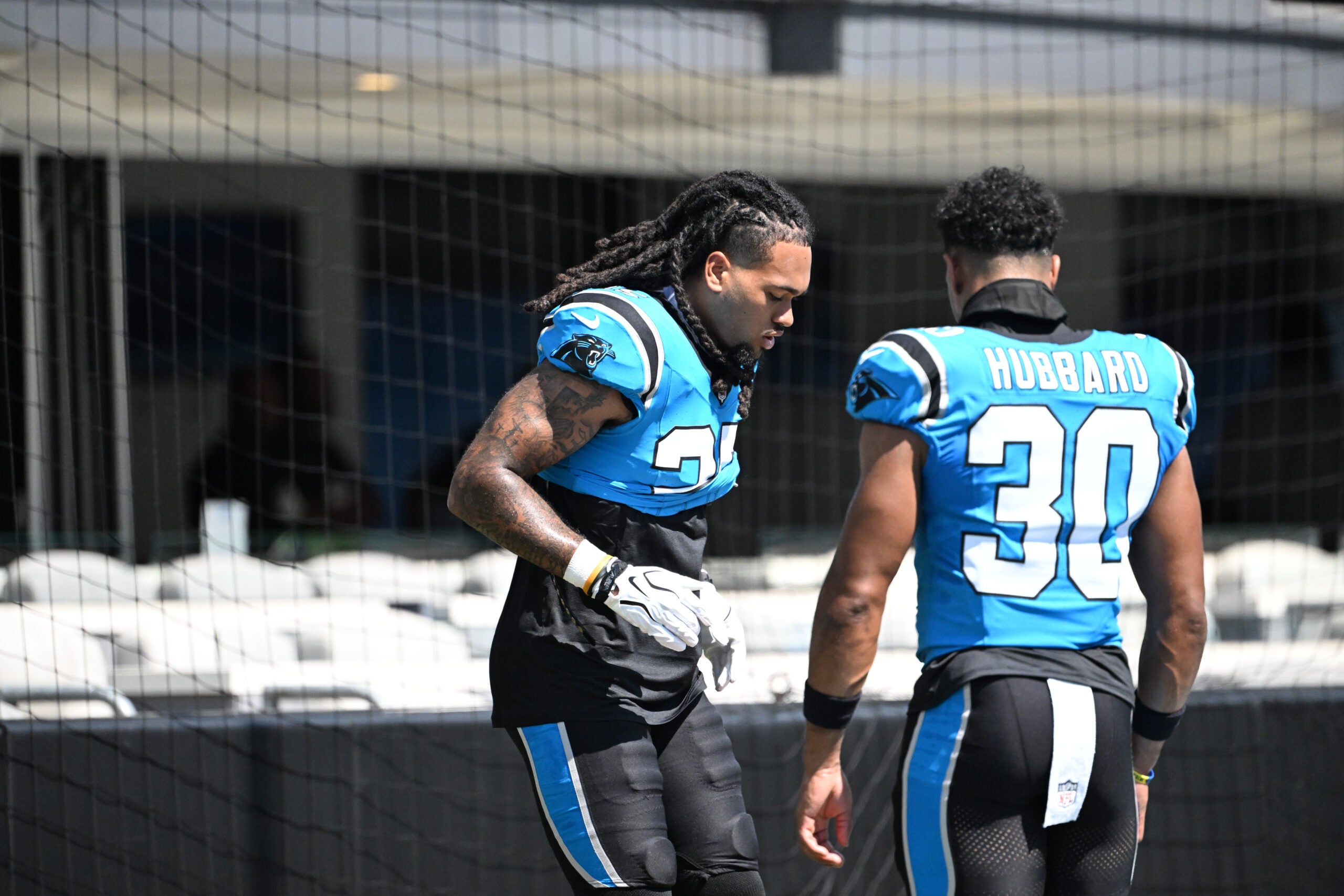 Sep 13, 2026; Charlotte, North Carolina, USA; Carolina Panthers running back Jonathon Brooks (25) and running back Chuba Hubbard (30) warm up before the game against the Chicago Bears at Bank of America Stadium.