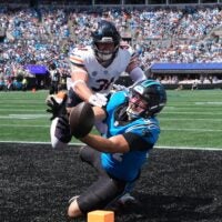 Sep 13, 2026; Charlotte, North Carolina, USA; Carolina Panthers tight end Mitchell Evans (84) is unable to make the catch while defended by Chicago Bears safety Dillon Thieneman (31) in the first quarter at Bank of America Stadium.