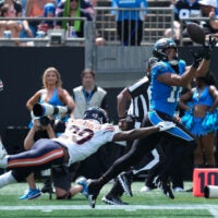 Sep 13, 2026; Charlotte, North Carolina, USA; Carolina Panthers wide receiver Jalen Coker (18) catches the ball while defended by Chicago Bears defensive back Tyrique Stevenson (29) in the second quarter at Bank of America Stadium.