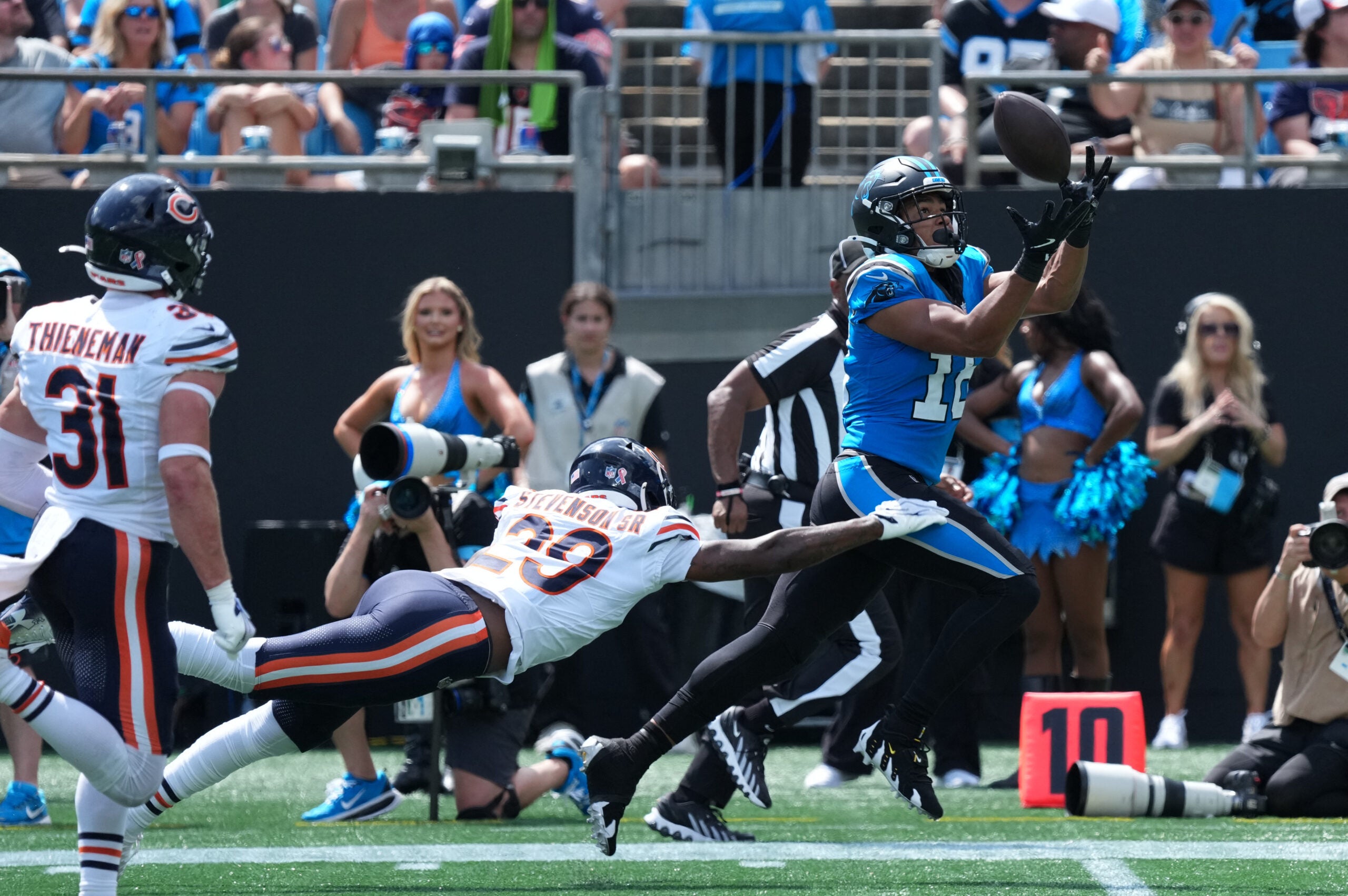 Sep 13, 2026; Charlotte, North Carolina, USA; Carolina Panthers wide receiver Jalen Coker (18) catches the ball while defended by Chicago Bears defensive back Tyrique Stevenson (29) in the second quarter at Bank of America Stadium.