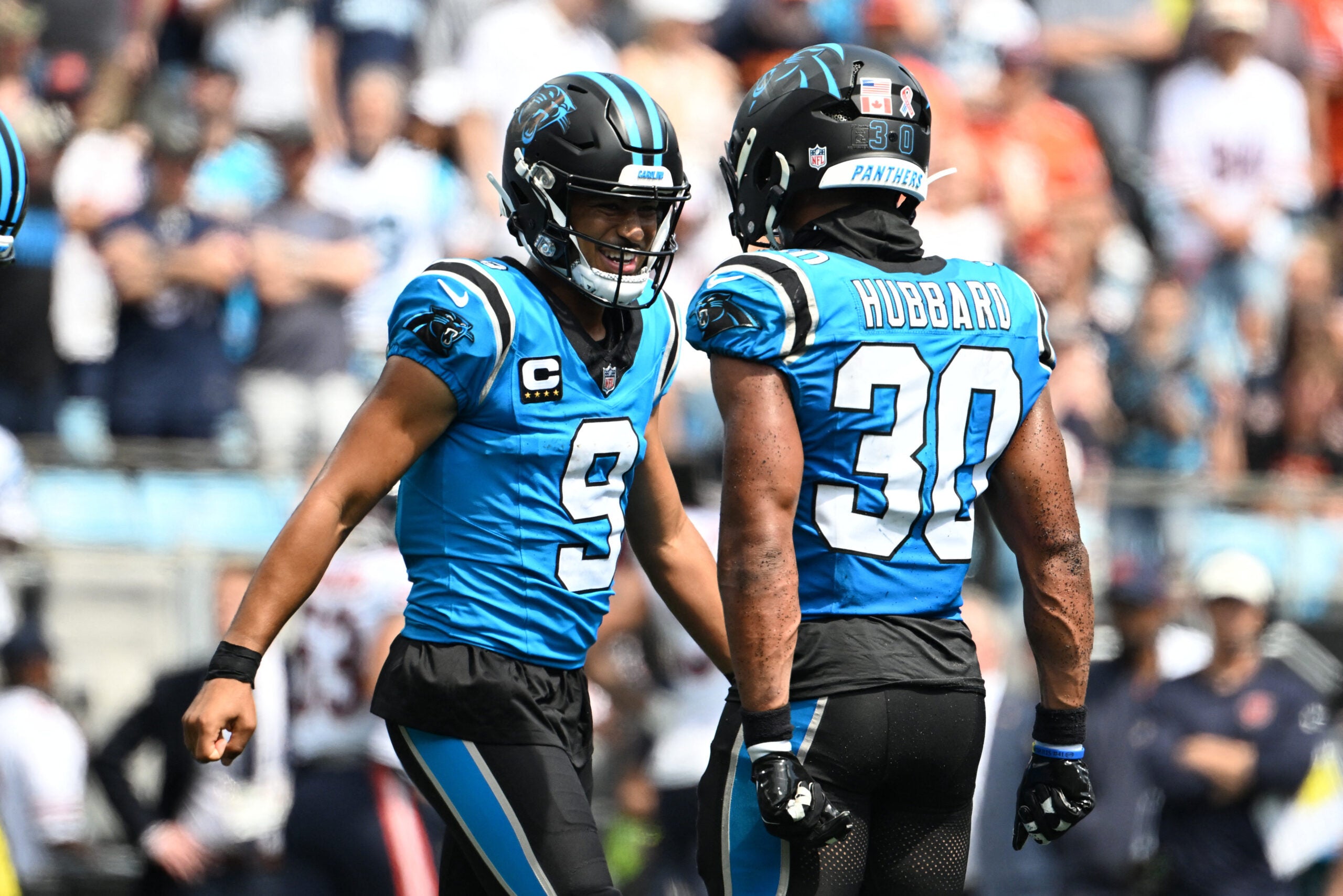 Sep 13, 2026; Charlotte, North Carolina, USA; Carolina Panthers quarterback Bryce Young (9) celebrates a touchdown with running back Chuba Hubbard (30) in the second quarter against the Chicago Bears at Bank of America Stadium.