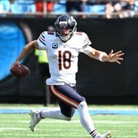 Sep 13, 2026; Charlotte, North Carolina, USA; Chicago Bears quarterback Caleb Williams (18) runs with the ball in the fourth quarter against the Carolina Panthers at Bank of America Stadium.