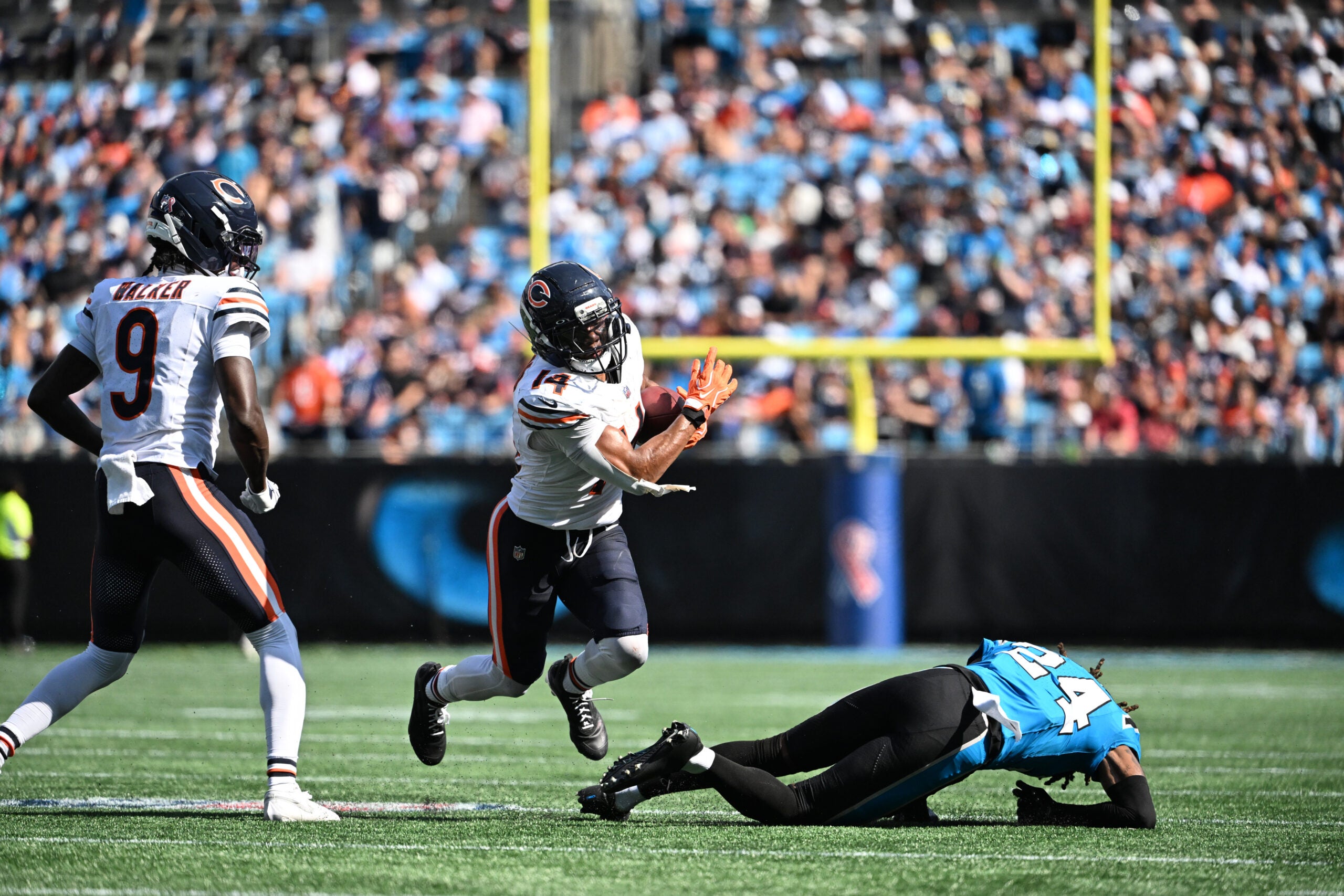 Sep 13, 2026; Charlotte, North Carolina, USA; Chicago Bears wide receiver Kalif Raymond (14) is tackled by Carolina Panthers cornerback Will Lee III (24) in the fourth quarter at Bank of America Stadium.