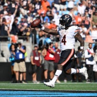 Sep 13, 2026; Charlotte, North Carolina, USA; Chicago Bears running back D'Andre Swift (4) runs with the ball for a touchdown in the fourth quarter against the Carolina Panthers at Bank of America Stadium.