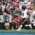 Sep 13, 2026; Charlotte, North Carolina, USA; Chicago Bears running back D'Andre Swift (4) runs with the ball for a touchdown in the fourth quarter against the Carolina Panthers at Bank of America Stadium.