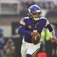 Sep 13, 2026; Minneapolis, Minnesota, USA; Minnesota Vikings quarterback Kyler Murray (1) runs the ball against the Green Bay Packers during the first half at U.S. Bank Stadium.