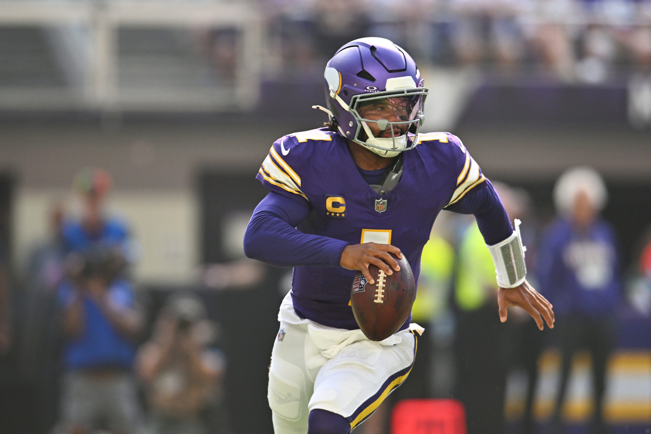 Sep 13, 2026; Minneapolis, Minnesota, USA; Minnesota Vikings quarterback Kyler Murray (1) runs the ball against the Green Bay Packers during the first half at U.S. Bank Stadium.