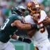 Sep 13, 2026; Philadelphia, Pennsylvania, USA; Washington Commanders quarterback Jayden Daniels (5) runs the ball against Philadelphia Eagles linebacker Zack Baun (53) during the first half at Lincoln Financial Field.