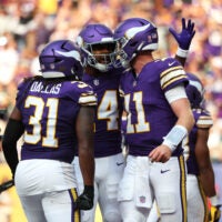 Sep 13, 2026; Minneapolis, Minnesota, USA; Minnesota Vikings quarterback Carson Wentz (11) celebrates a touchdown during the first half against the Green Bay Packers at U.S. Bank Stadium.