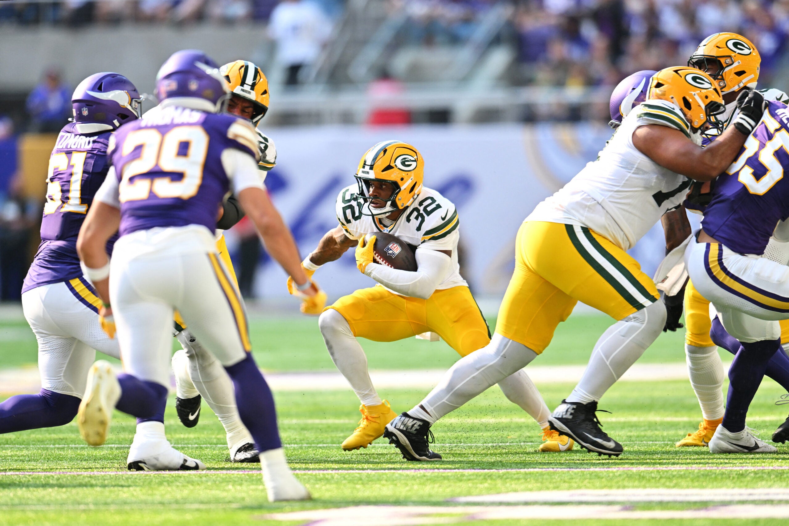 Sep 13, 2026; Minneapolis, Minnesota, USA; Green Bay Packers running back MarShawn Lloyd (32) runs the ball during the second half against the Minnesota Vikings at U.S. Bank Stadium.