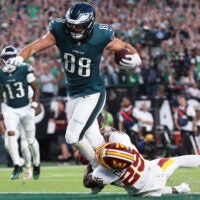 Sep 13, 2026; Philadelphia, Pennsylvania, USA; Philadelphia Eagles tight end Dallas Goedert (88) scores a touchdown against Washington Commanders cornerback Rasul Douglas (29) during the second half at Lincoln Financial Field.