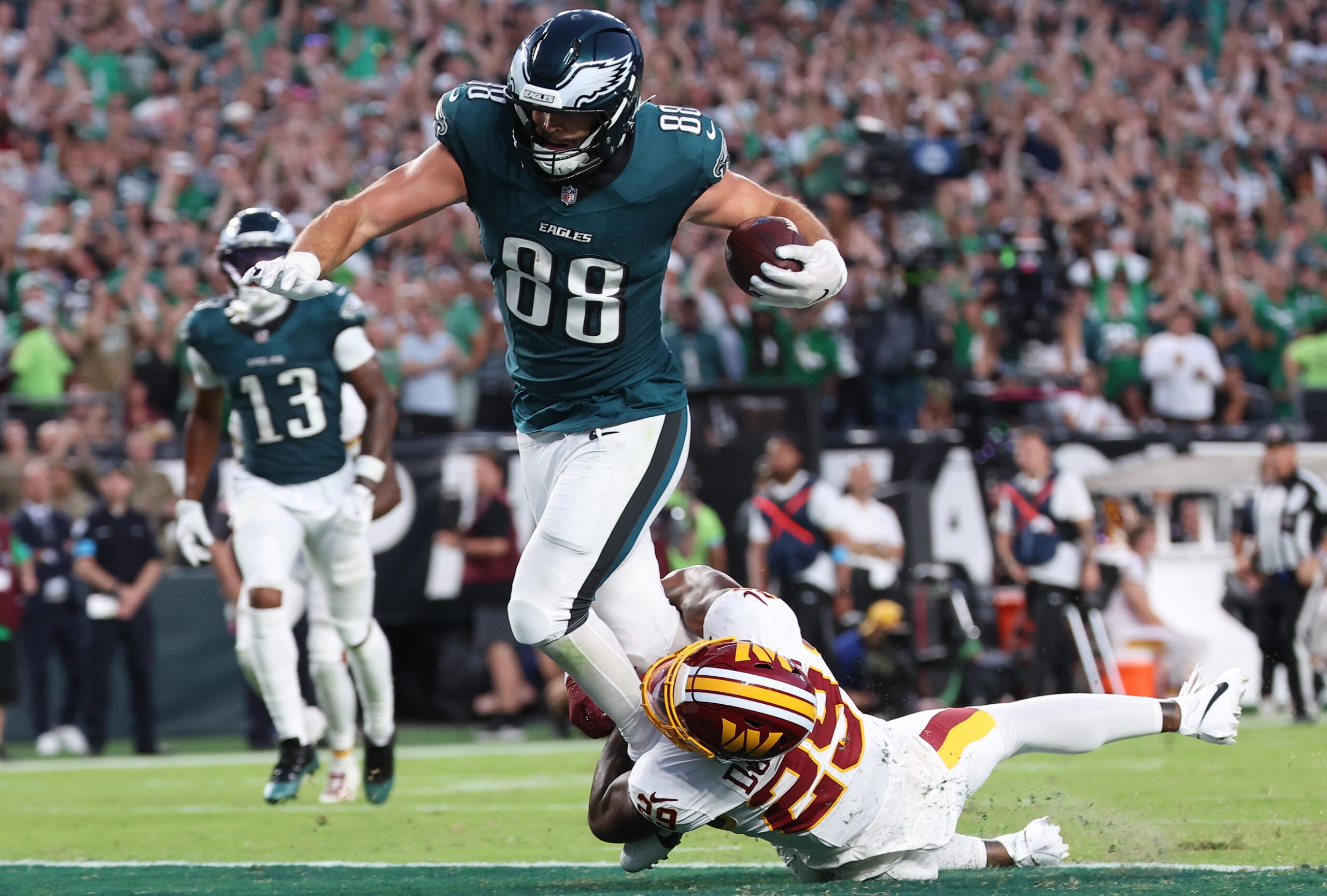 Sep 13, 2026; Philadelphia, Pennsylvania, USA; Philadelphia Eagles tight end Dallas Goedert (88) scores a touchdown against Washington Commanders cornerback Rasul Douglas (29) during the second half at Lincoln Financial Field.