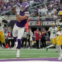 Minnesota Vikings tight end T.J. Hockenson (87) catches a touchdown pass between Green Bay Packers linebacker Zaire Franklin (44) and safety Xavier McKinney (29) during the third quarter of their game Sunday, Sept. 13, 2026 at U.S. Bank Stadium in Minneapolis, Minnesota. The Minnesota Vikings beat the Green Bay Packers 39-22.