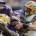 Green Bay Packers defensive end Lukas van Ness (90) stuffs Minnesota Vikings running back Aaron Jones Sr. (33) at the line during the second quarter of their game Sunday, Sept. 13, 2026 at U.S. Bank Stadium in Minneapolis, Minnesota.