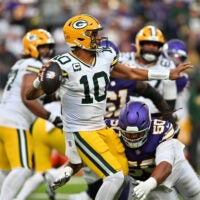 Sep 13, 2026; Minneapolis, Minnesota, USA; Minnesota Vikings defensive line Levi Drake Rodriguez (50) tackles Green Bay Packers quarterback Jordan Love (10) as he makes a pass during the second half at U.S. Bank Stadium.