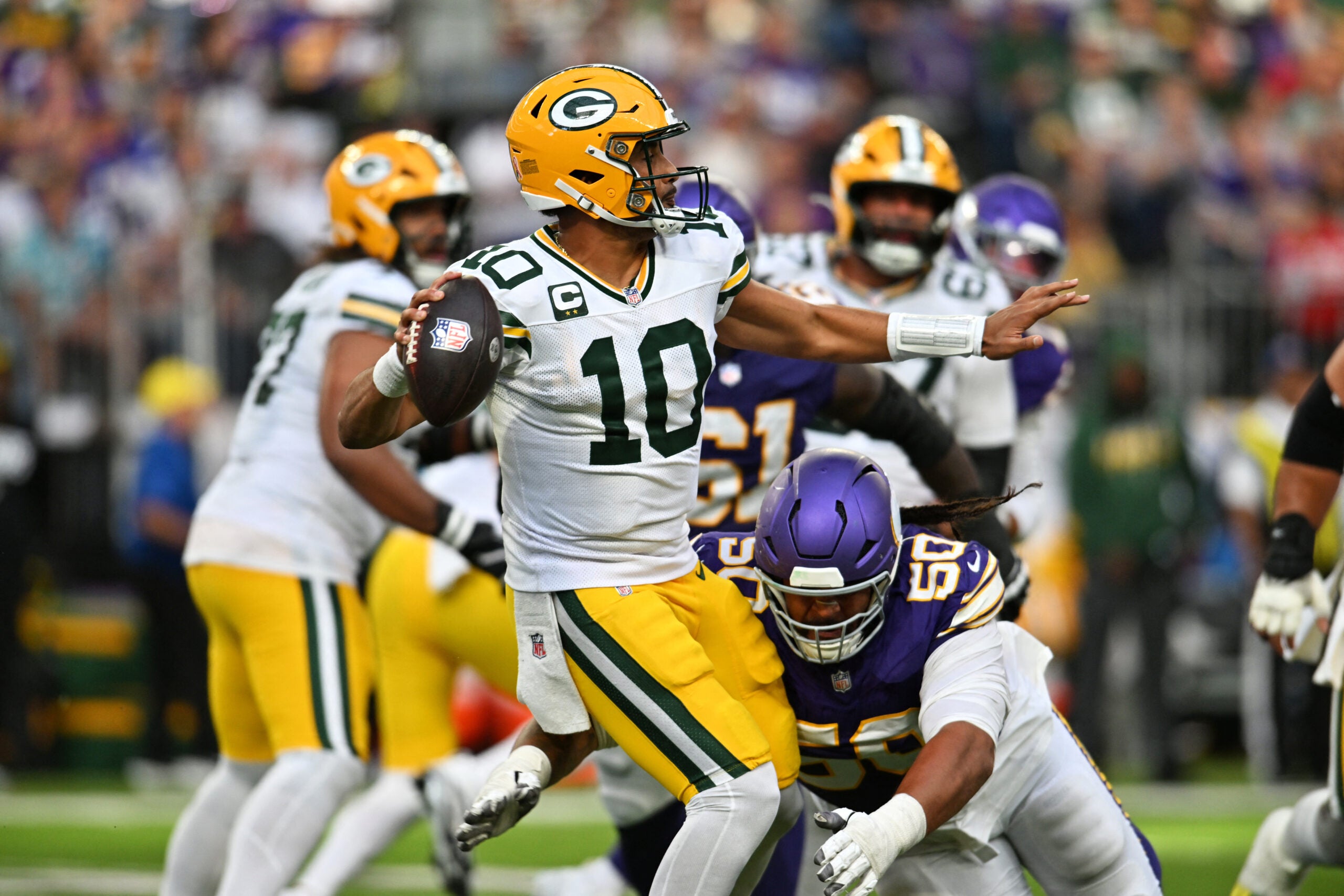 Sep 13, 2026; Minneapolis, Minnesota, USA; Minnesota Vikings defensive line Levi Drake Rodriguez (50) tackles Green Bay Packers quarterback Jordan Love (10) as he makes a pass during the second half at U.S. Bank Stadium.