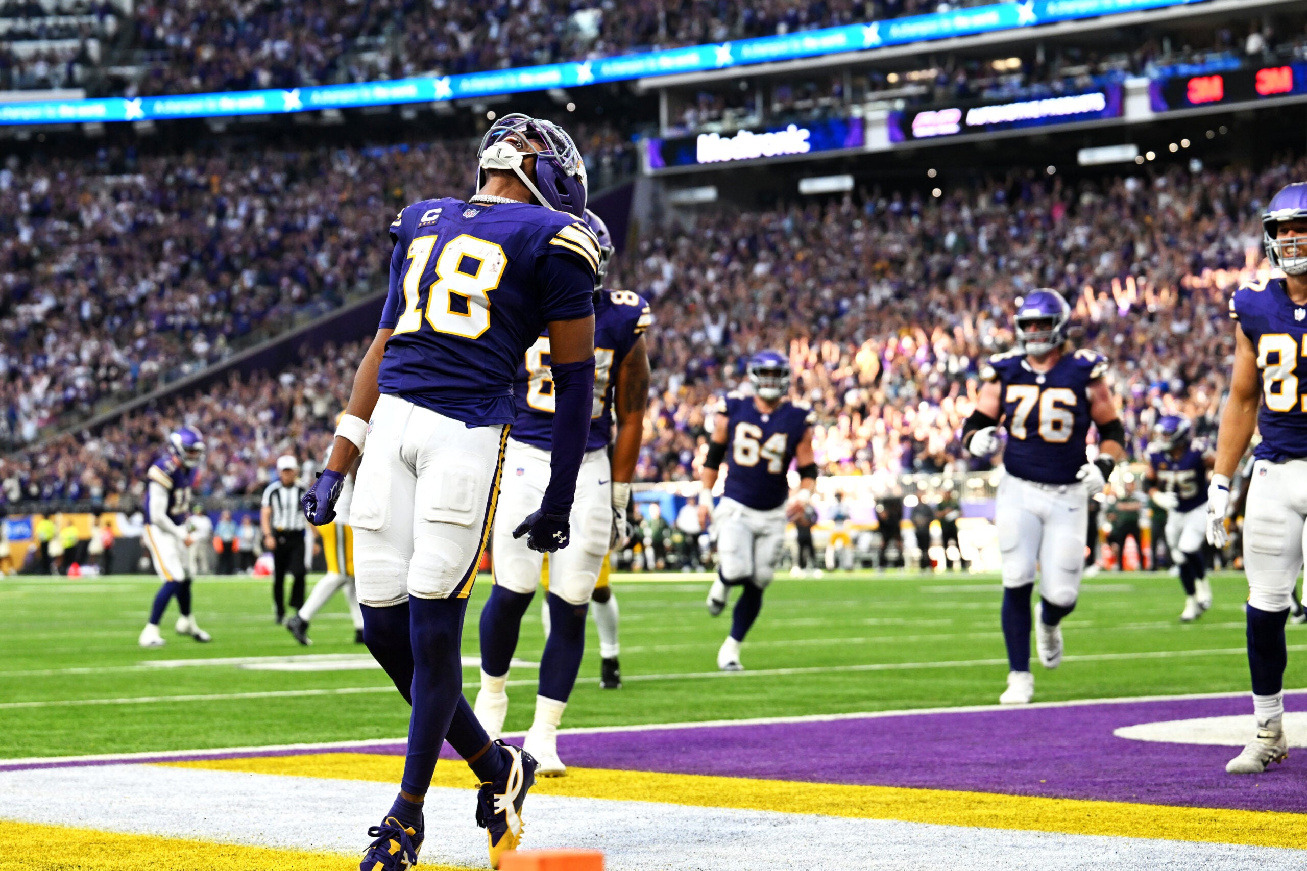 Sep 13, 2026; Minneapolis, Minnesota, USA; Minnesota Vikings wide receiver Justin Jefferson (18) celebrates after a touchdown during the second half against the Green Bay Packers at U.S. Bank Stadium.
