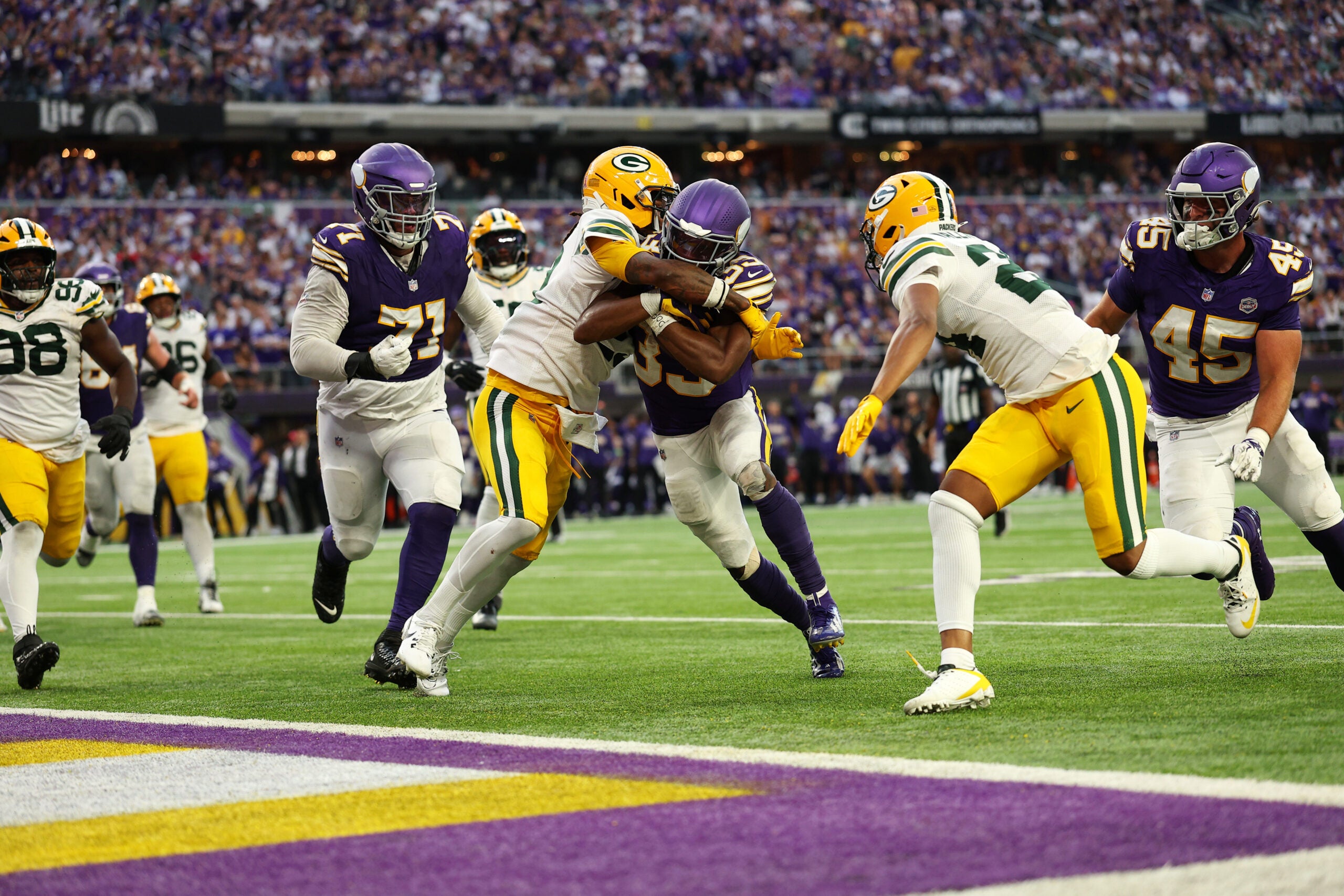 Sep 13, 2026; Minneapolis, Minnesota, USA; Minnesota Vikings running back Aaron Jones Sr. (33) pushes for a touchdown during the second half against the Green Bay Packers at U.S. Bank Stadium.