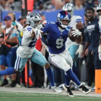 Sep 13, 2026; East Rutherford, New Jersey, USA; New York Giants tight end Isaiah Likely (9) carries the ball defended by Dallas Cowboys cornerback Shavon Revel Jr. (28) during the second quarter at MetLife Stadium.