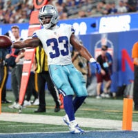 Sep 13, 2026; East Rutherford, New Jersey, USA; Dallas Cowboys running back Javonte Williams (33) carries the ball for a touchdown against the New York Giants during the fourth quarter at MetLife Stadium.