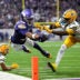 Sep 13, 2026; Minneapolis, Minnesota, USA; Minnesota Vikings wide receiver Justin Jefferson (18) reaches for a touchdown during the second half against Green Bay Packers cornerback Keisean Nixon (25) at U.S. Bank Stadium.