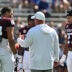 Sep 12, 2026; College Station, Texas, USA; Texas A&M Aggies head coach Mike Elko speaks with his captains prior to the game against Arizona State Sun Devils at Kyle Field.